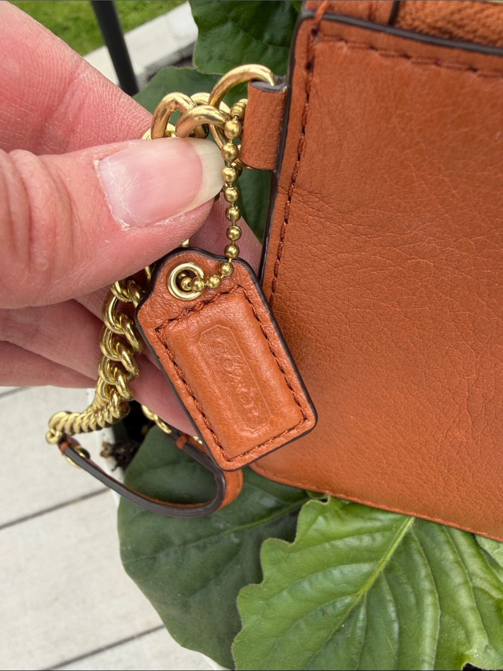 Coach Tan Leather Zip Wristlet with Gold Hardware and theme park themed bag tag - Picture 2 of 7